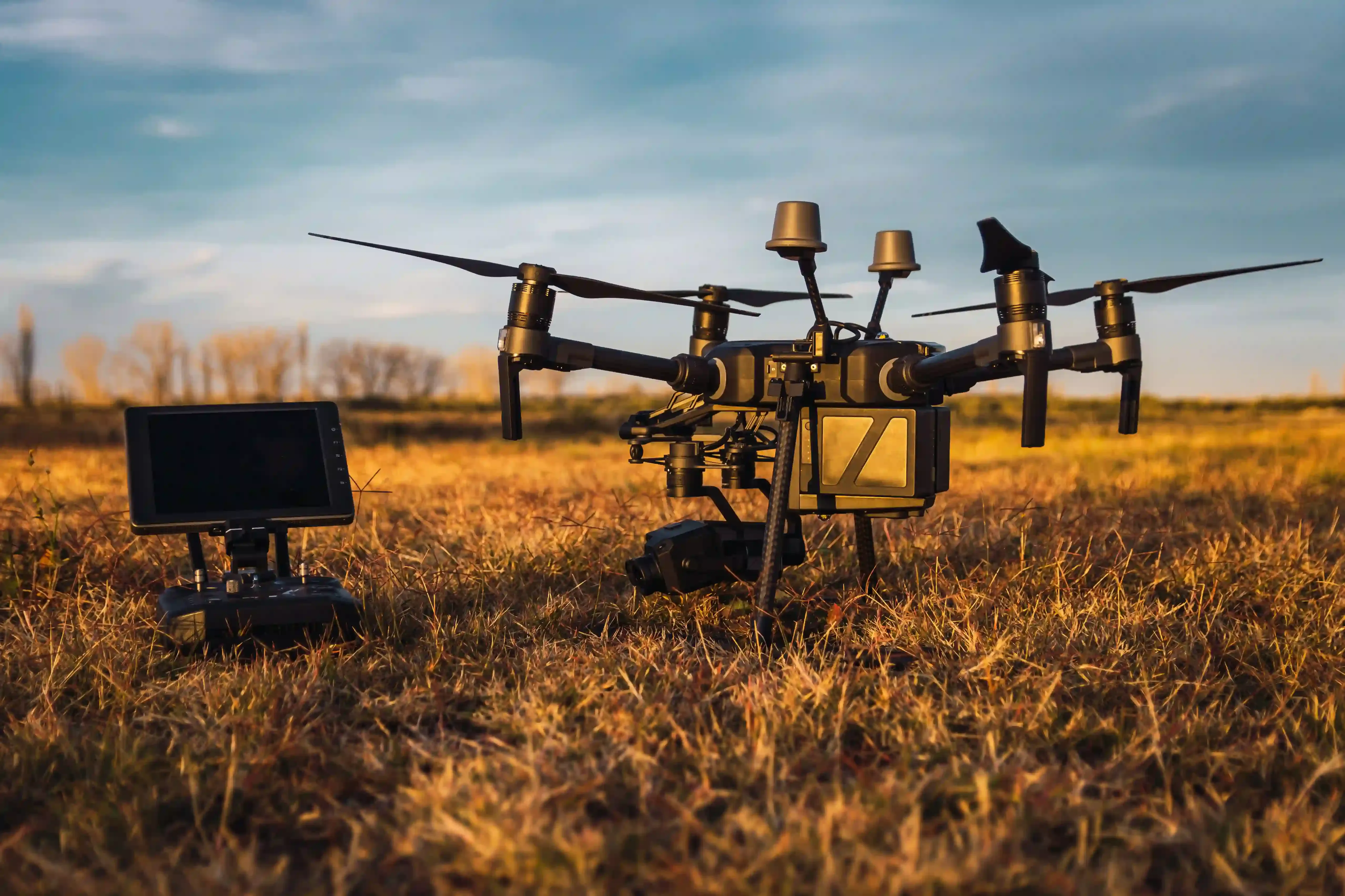 Drone and industrial radio control at sunset