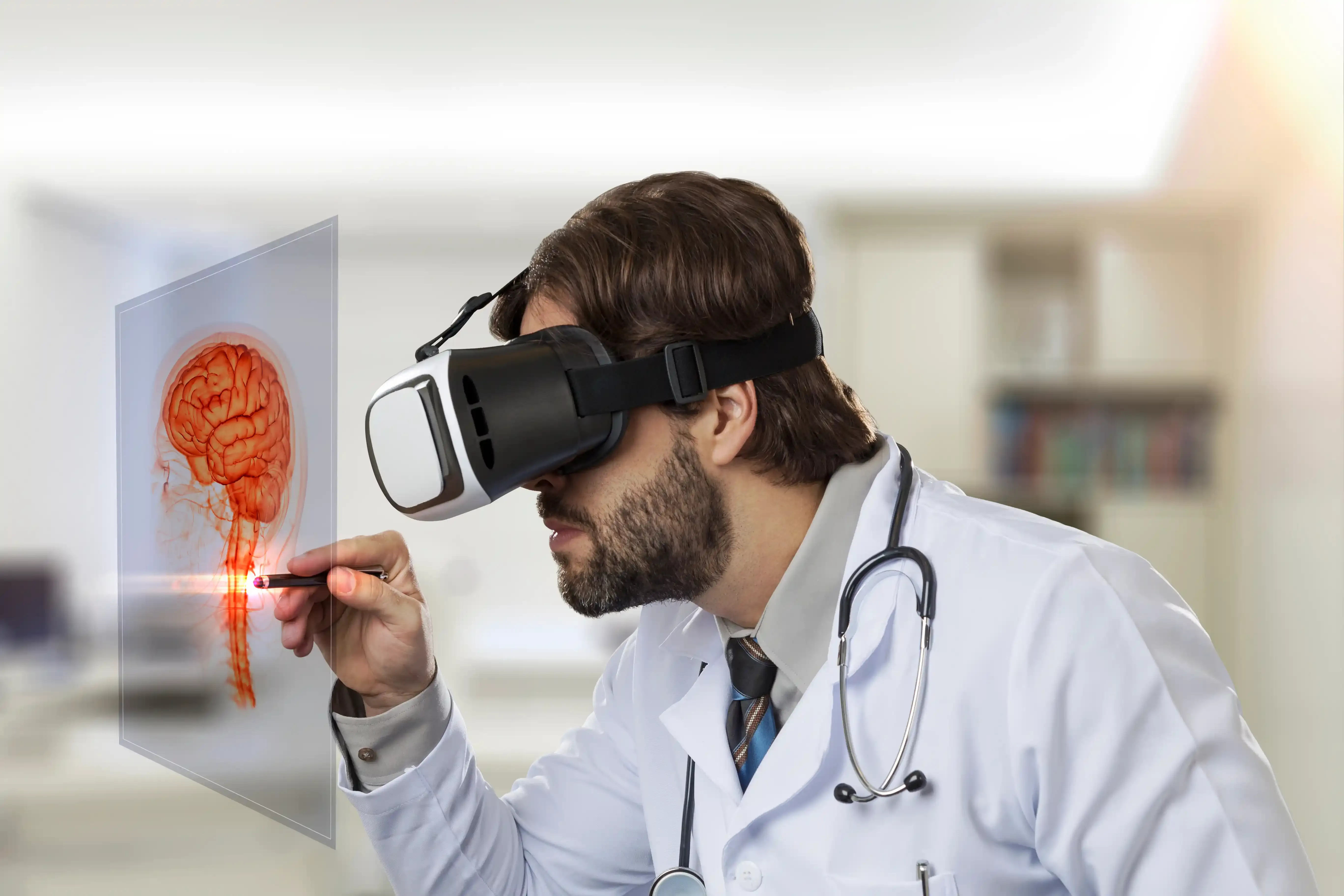 Male doctor in his office, using a virtual reality glasses, looking at a virtual brain
